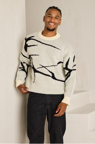 Pull blanc à motif noir