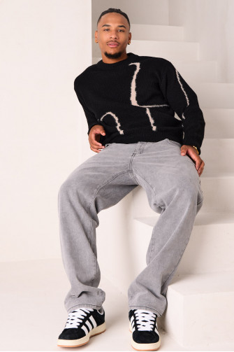 Pull en maille noir à empiècement duveteux beige