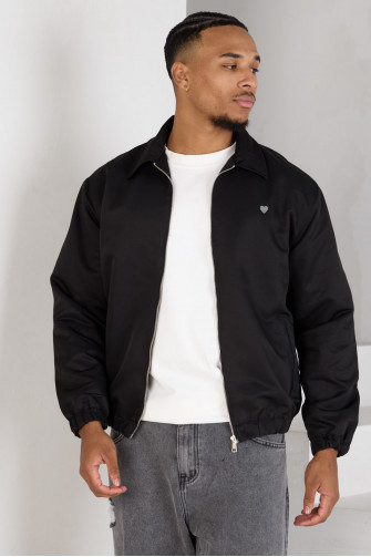 Veste noire zippée à cœur sur la poitrine