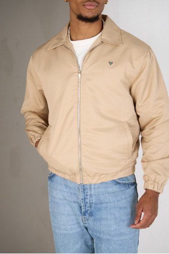 Veste beige foncé zippée à cœur sur la poitrine