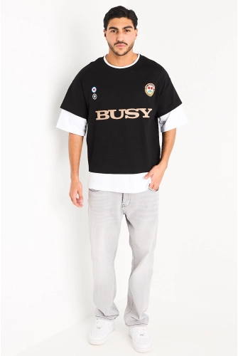 Tee-shirt noir à manches trois quarts blanches effet superposition et broderies