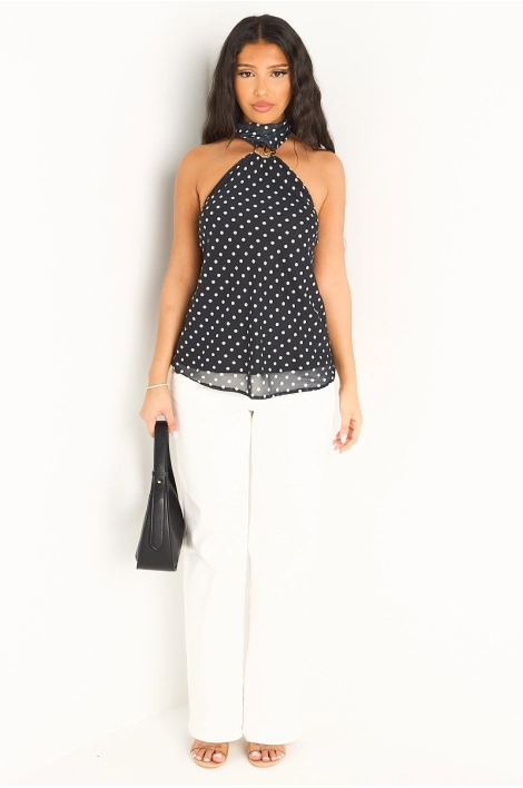 Haut noir col ras-de-cou et motifs à pois