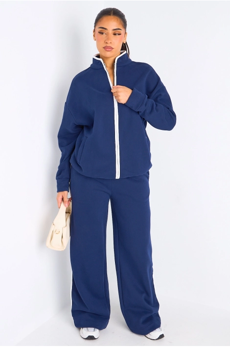 Ensemble deux pièces bleu à bandes blanches veste + jogging coupe droite