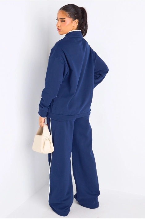 Ensemble deux pièces bleu à bandes blanches veste + jogging coupe droite