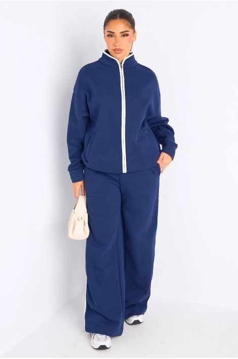 Ensemble deux pièces bleu à bandes blanches veste + jogging coupe droite