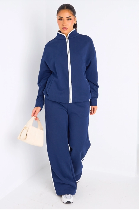 Ensemble deux pièces bleu à bandes blanches veste + jogging coupe droite