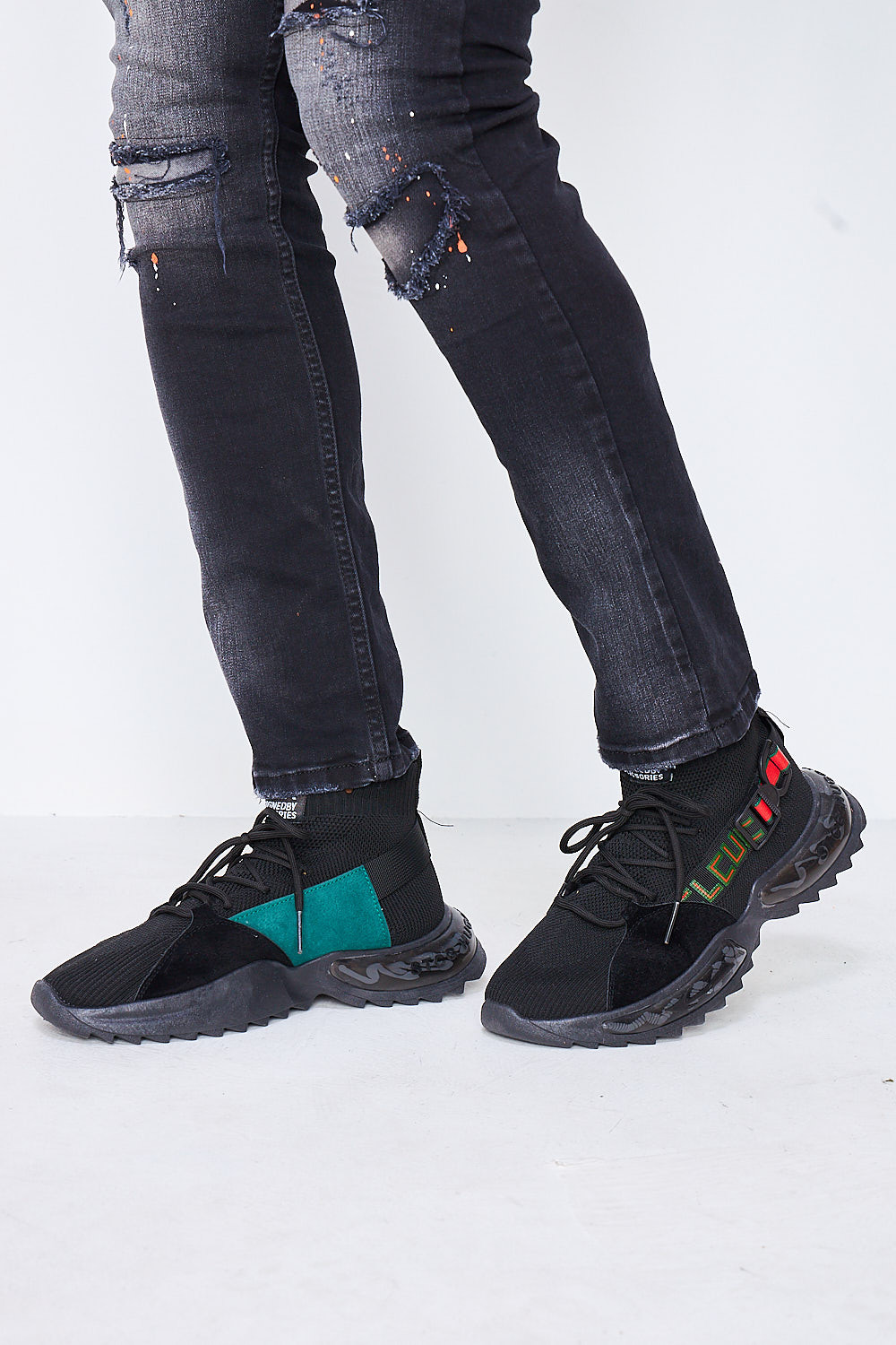 Baskets chaussettes noires détail vert