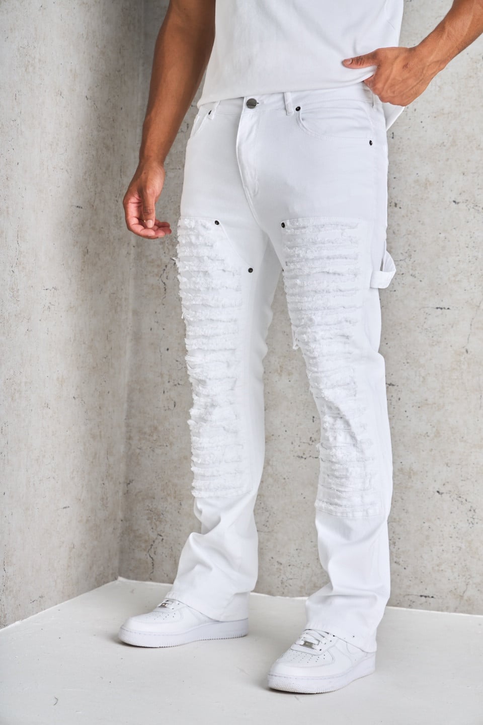 Jean blanc déchiré