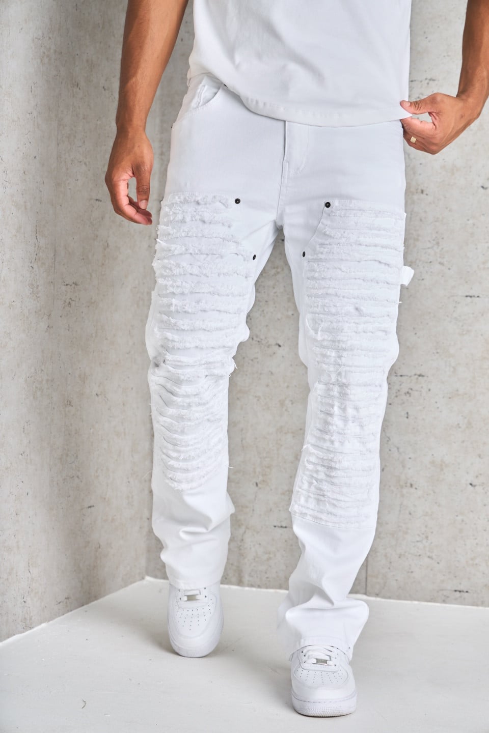Jean blanc déchiré