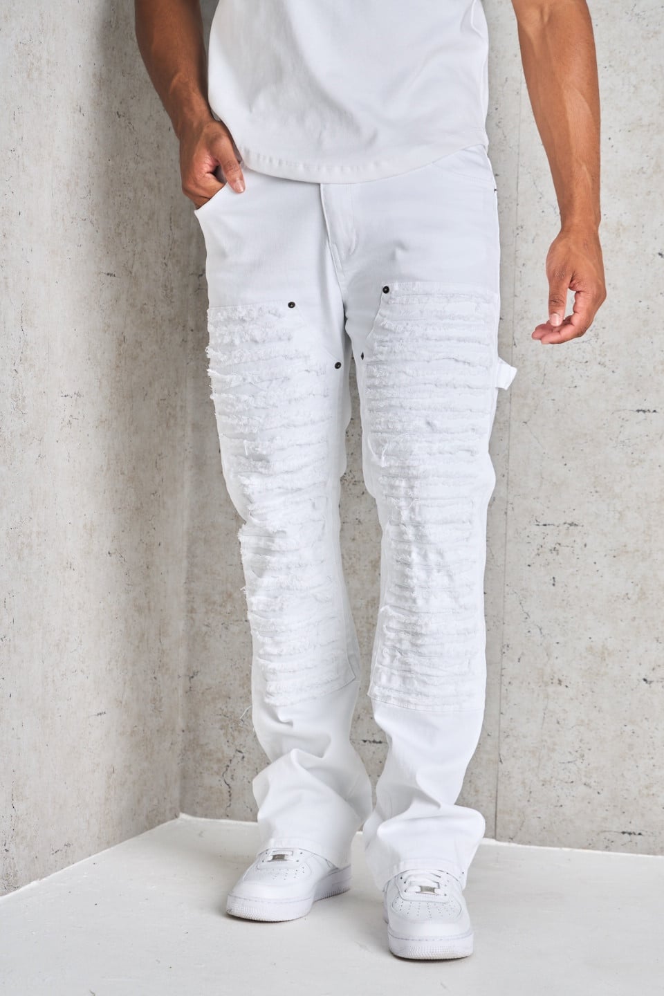 Jean blanc déchiré