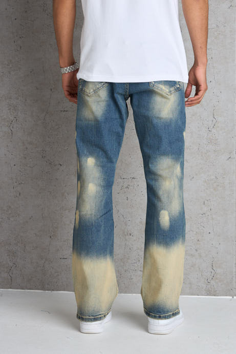 Jean bleu foncé coupe large délavé et taché