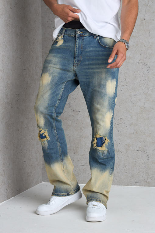 Jean bleu foncé coupe large délavé et taché