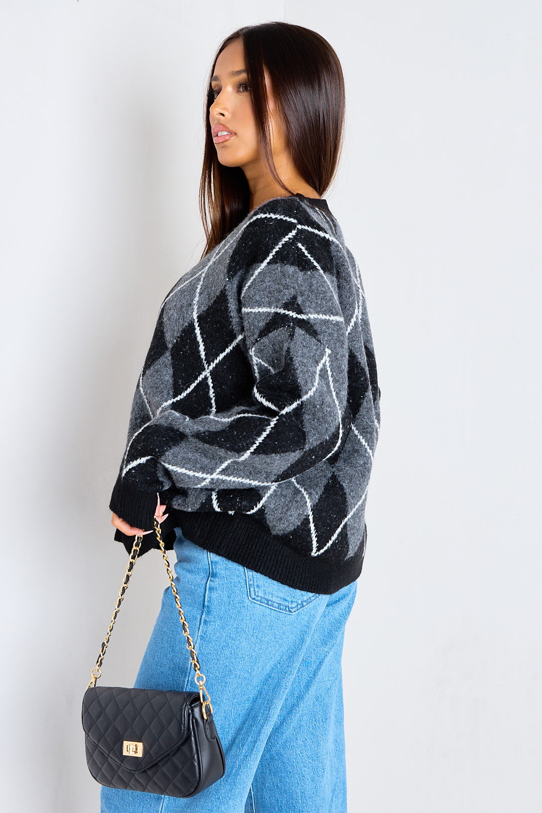 Pull noir en laine à motifs losanges écossais