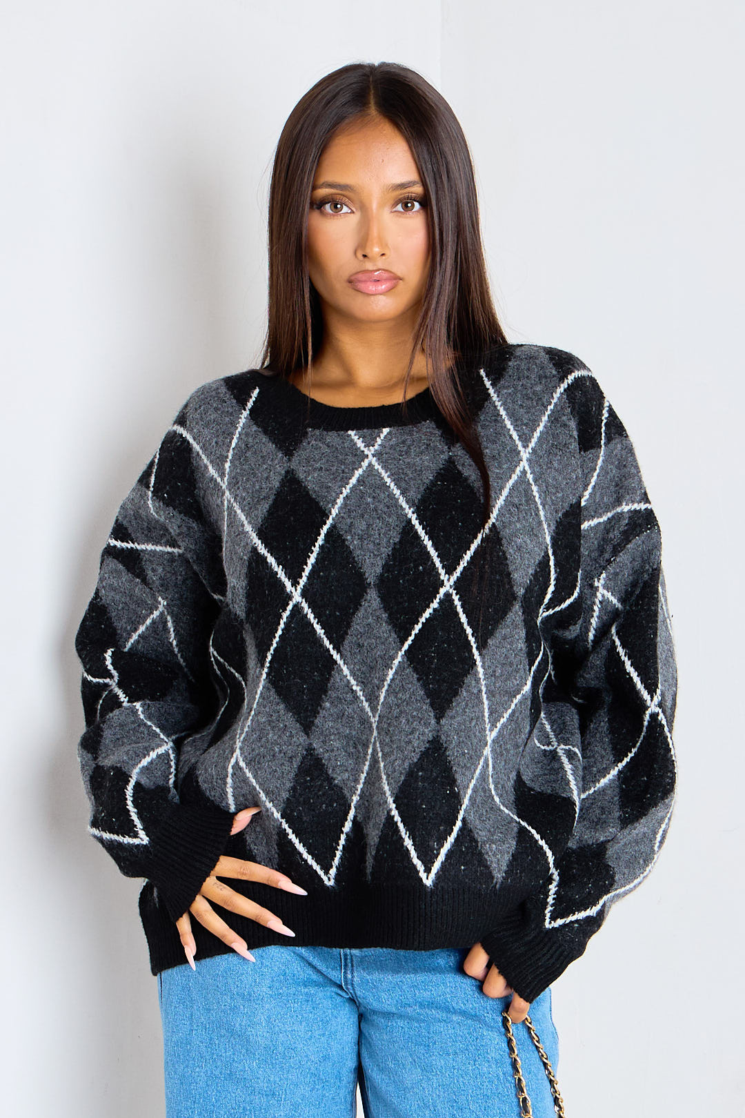 Pull noir en laine à motifs losanges écossais
