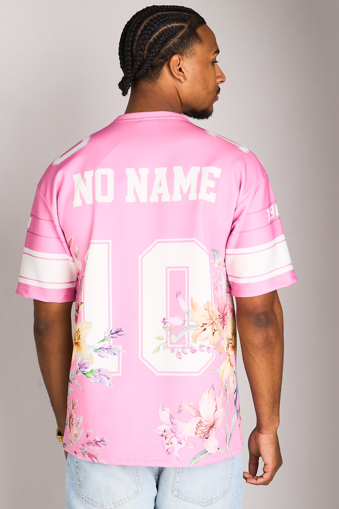 Tee-shirt rose à motifs floraux et inscriptions