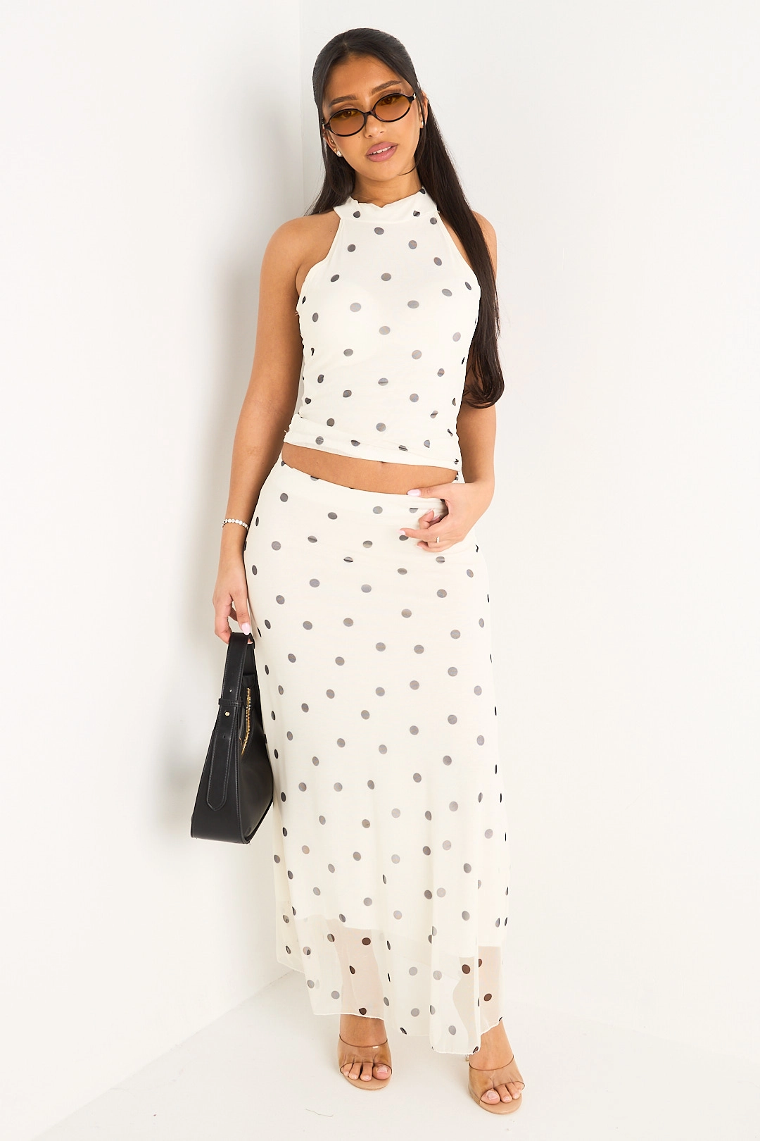 Ensemble deux pièces blanc à pois top sans manches à col montant + jupe longue