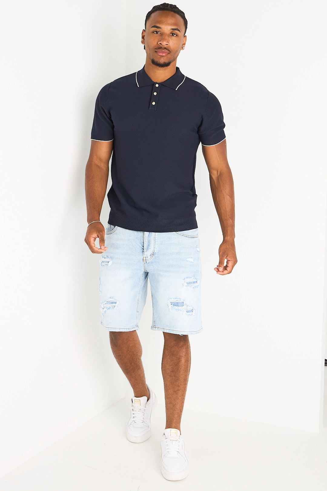 Polo manches courtes bleu foncé à bandes blanches