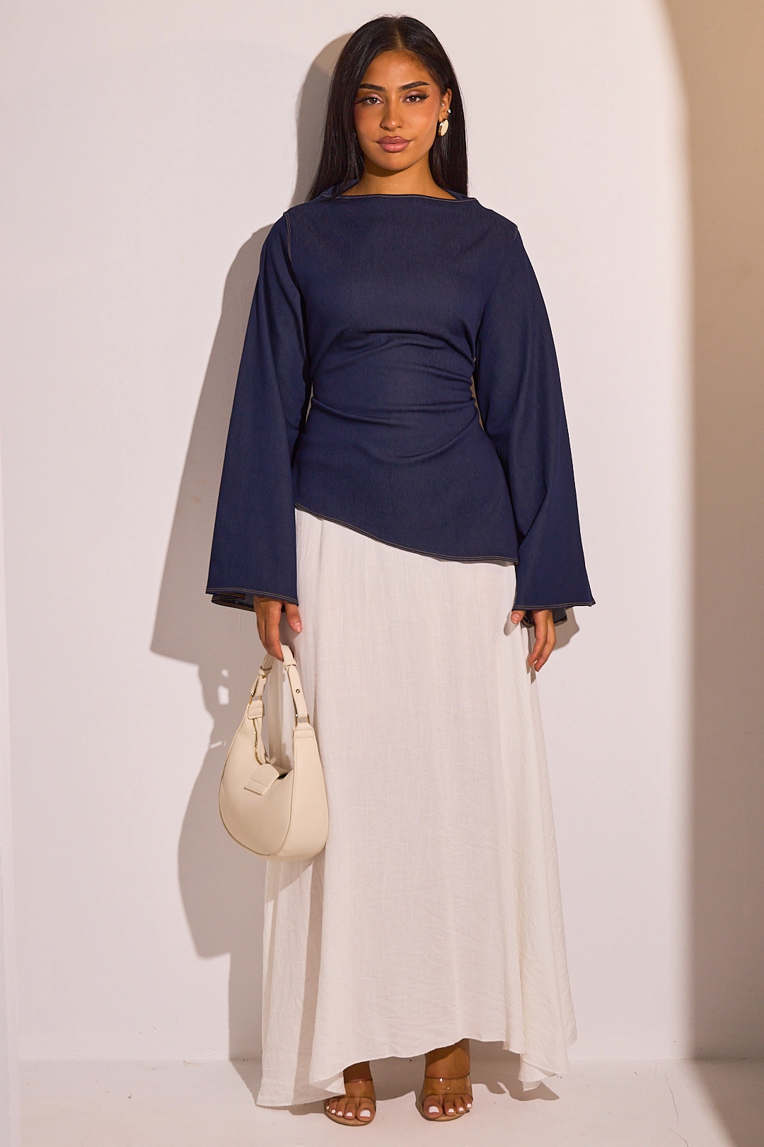 Haut asymétrique bleu à manches longues effet Jean
