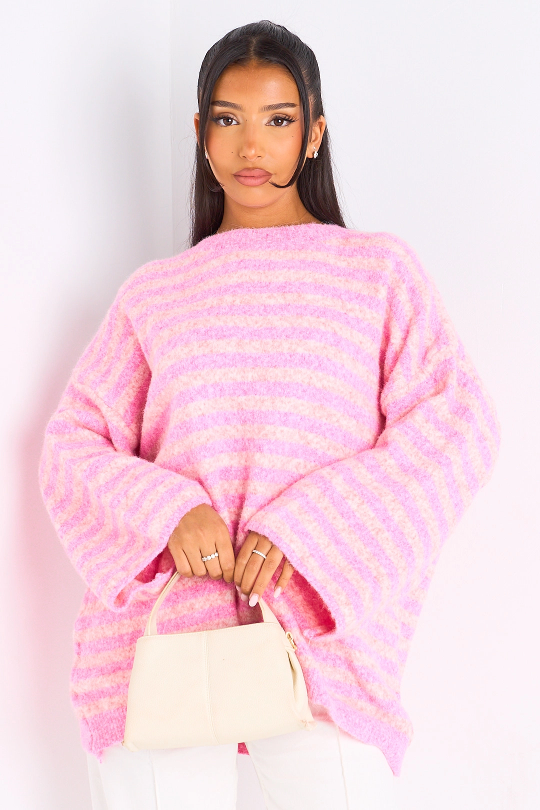 Pull en laine rose à rayures rose clair