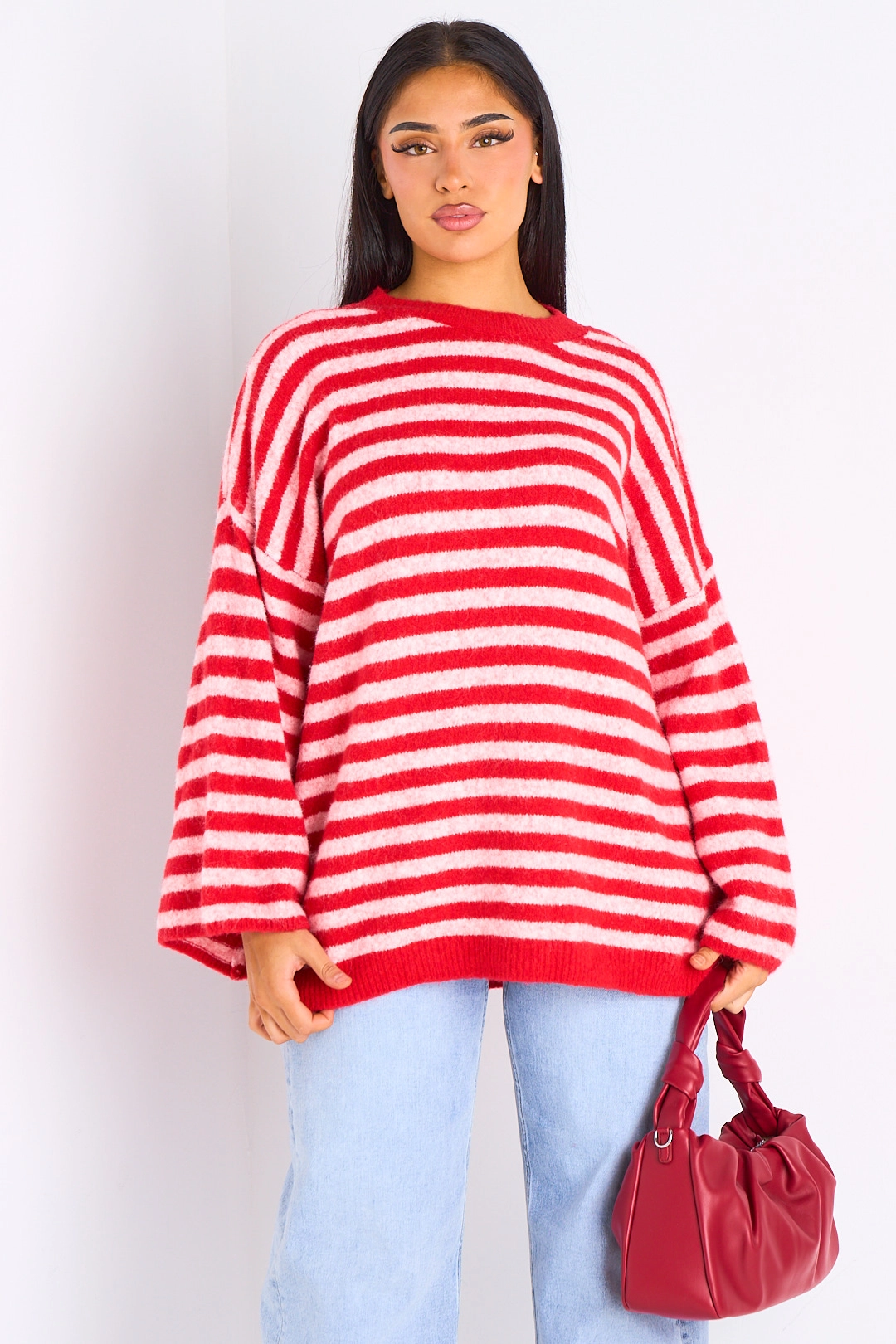 Pull en laine rouge à rayures rose clair
